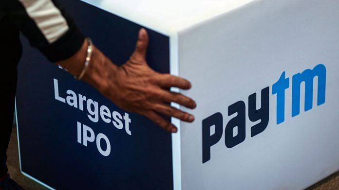 A worker prepares the stage during the listing ceremony for the IPO of One97 Communications, operator of PayTM, at the Bombay Stock Exchange, in Mumbai on 18 November 2021 | Photographer: Dhiraj Singh | Bloomberg