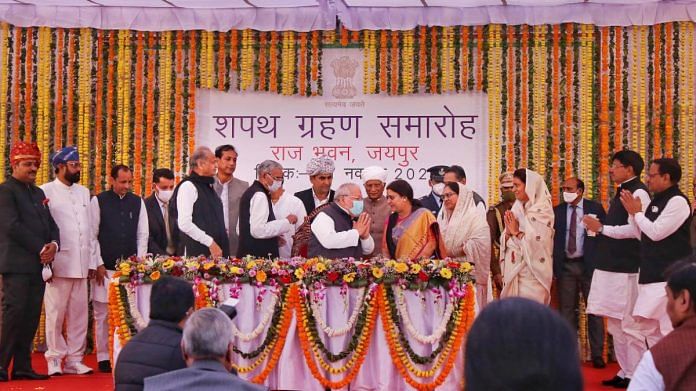 Rajasthan CM Ashok Ghelot and Governor Kalraj Mishra pose with new Cabinet ministers after the swearing-in ceremony at Raj Bhawan in Jaipur, on 21 November 2021 | PTI
