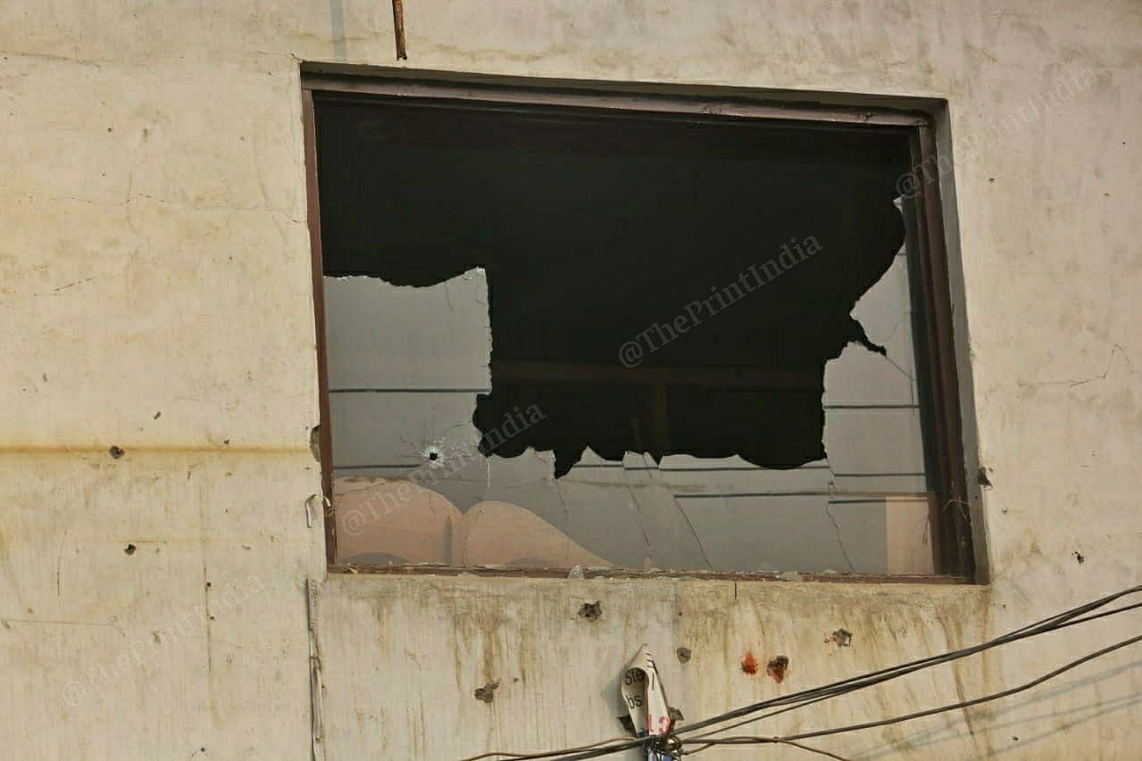 Bullet marks on the window where the encounter took place in Srinagar's Hyderpora. | Photo: Praveen Jain/ThePrint
