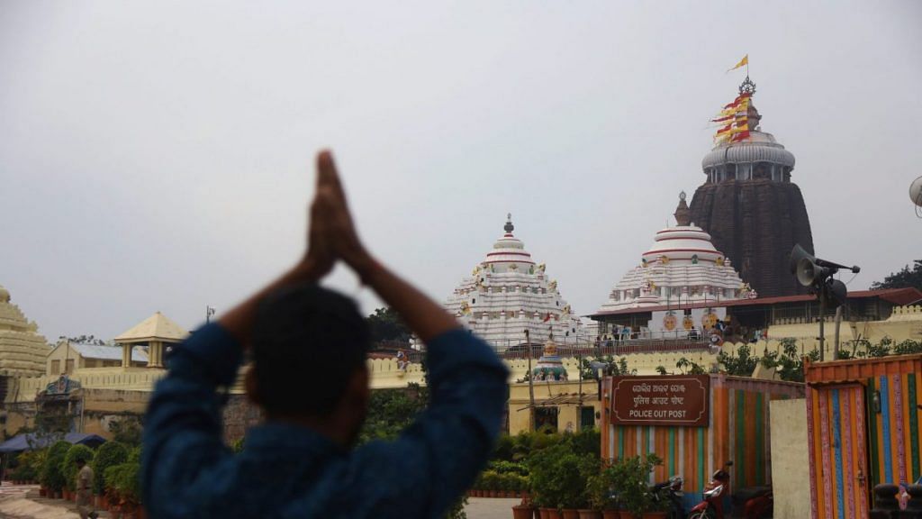 A worshipper folds hands outside Jagannath temple | Photo: Manisha Mondal | ThePrint