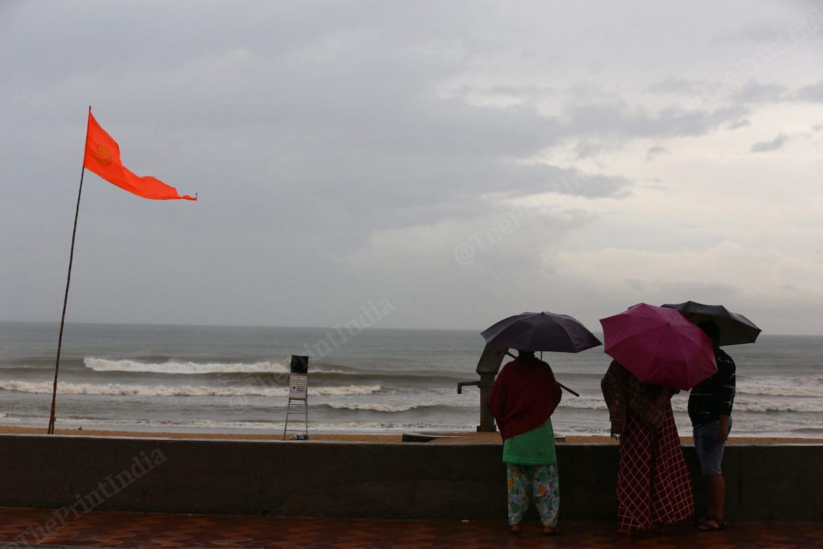 Due to the cyclone alert in Odisha, the Puri was cleared. After Jawad subsided, tourists look at the sea, as the beach remain closed | Photo: Manisha Mondal | ThePrint