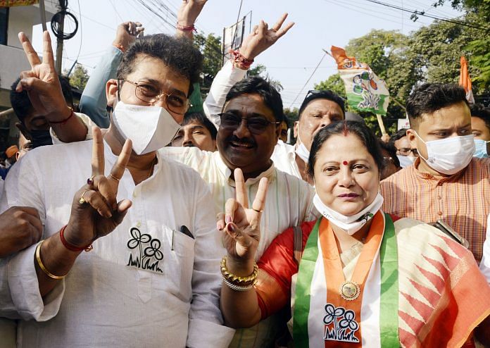 Kajari Banerjee (right) with husband Kartik (centre) and fellow candidate Asim Bose in Kolkata on 27 November. | ANI