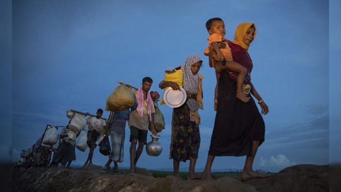 Rohingya refugees flee Myanmar and head towards Cox's Bazar in Bangladesh (file photo) | Bloomberg