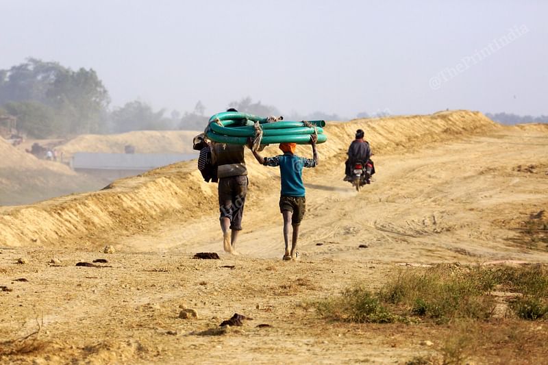 Local villagers carrying water pipe to supply water in their field at Saryu Nahar Pariyojna | Photo: Praveen Jain| ThePrint