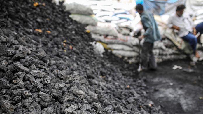 A stack of coal at a coal wholesale market in Mumbai | Photo Dhiraj Singh | Bloomberg