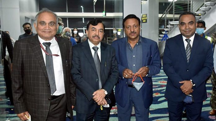 CEC Sushil Chandra (2L) with EC Rajiv Kumar (2R), Anup Chandra Pandey (L) and Goa Chief Electoral Officer Kunal IAS (R) at Dabolim Airport, in Goa's Mormugao on 21 December 2021 | ANI Photo