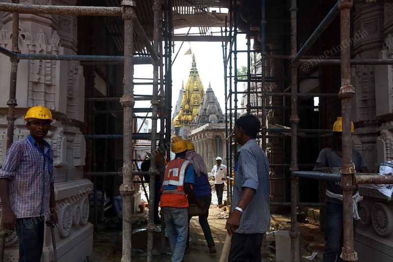 A construction worker at the Kashi Vishwanath Dham site | Photo: Praveen Jain | ThePrint