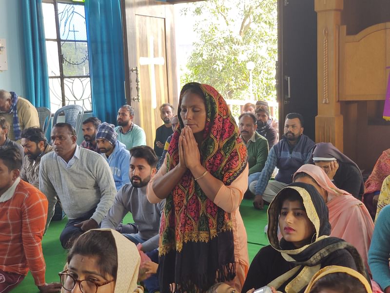 A woman prays at a church in Fatehgarh Churian, Gurdaspur | Shubhangi Misra | ThePrint