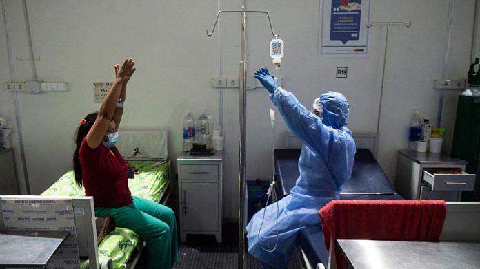 A health professional helps a Covid patient excercise at the ICU of the Virgen de Fatima contingency hospital in Sullana, Piura, northern Peru | Representational image | Photographer: Ernesto Benavides/AFP/Getty Images via Bloomberg