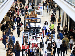 Representational image of people walking through a shopping mall | Photo: Gabby Jones | Bloomberg