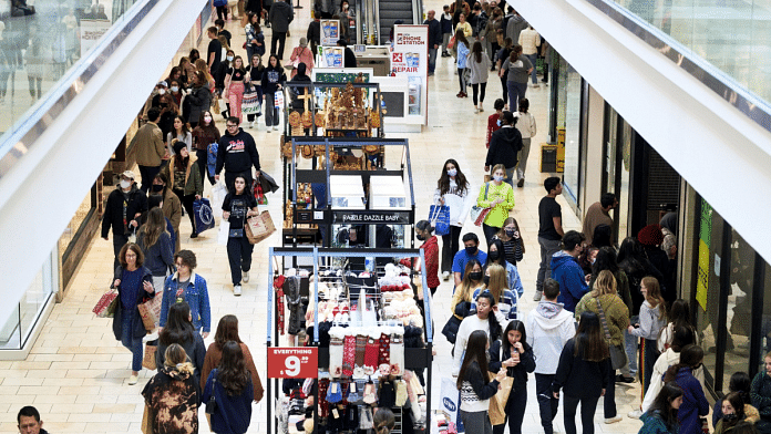 Representational image of people walking through a shopping mall | Photo: Gabby Jones | Bloomberg