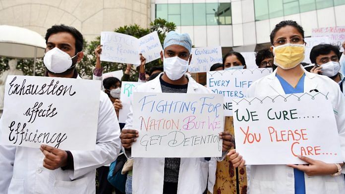 Sir Ganga Ram hospital Consultants, Residents and DNB students hold placards during a protest in New Delhi, on 30 December 2021 | PTI