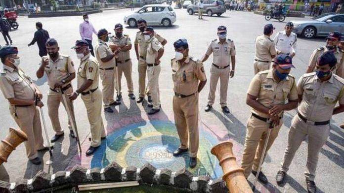 Police personnel stand guard as activists stage a protest against Karnataka government at Shivaji Maharaj Chowk, after some miscreants vandalised a statue of Shivaji Maharaj in Bengaluru, in Navi Mumbai on 19 December 2021 | PTI