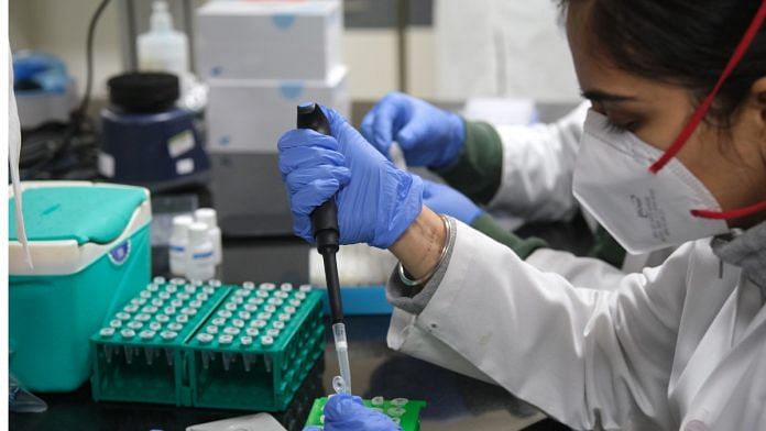 File photo of a technician using a pipette while preparing test samples inside a Covid-19 Genome Sequencing Laboratory in New Delhi| Photographer: T. Narayan/Bloomberg