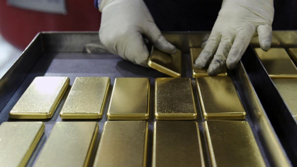 An employee arranges one kilogram gold bars at the Perth Mint Refiner in Australia | Representational image | Bloomberg