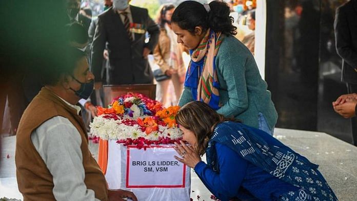 Wife and daughter of late Brigadier LS Lidder pay their last respects to him at Brar Square, Delhi Cantt, in New Delhi. Lidder lost his life in an IAF chopper crash near Coonoor in Tamil Nadu on 8 Dec 2021 | File photo: PTI