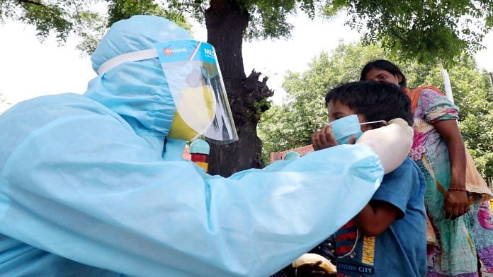 Students distribute face masks among the poor people in Lucknow. | File photo: ANI