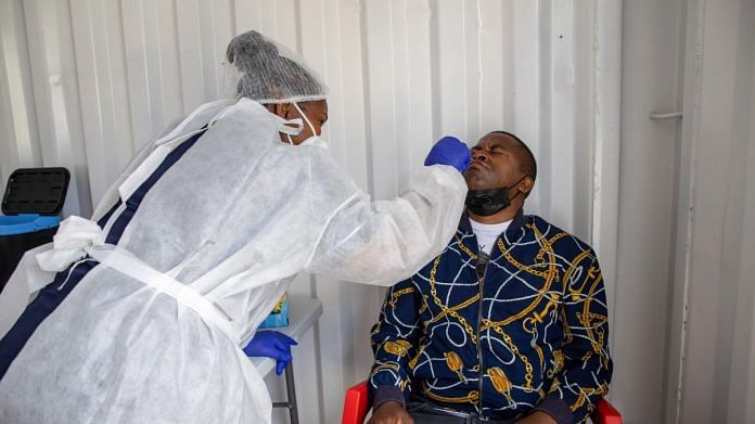 A health worker administers a nasal swab test at a Covid mobile testing site in the Milnerton district of Cape Town | Representational image | Bloomberg