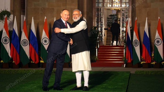 Prime Minister Narendra Modi greets Russian President Vladimir Putin before a meeting at Hyderabad House on 6 December. `| Photo: Praveen Jain | ThePrint