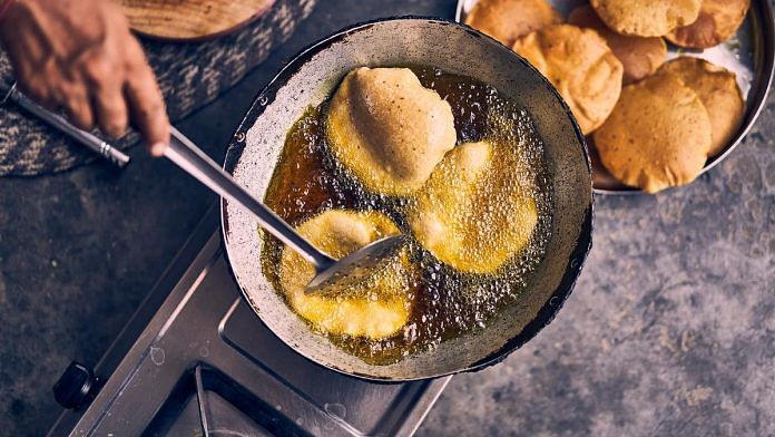 Representational image of food being cooked in oil | Photo: Ashwini Chaudhary/Unsplash