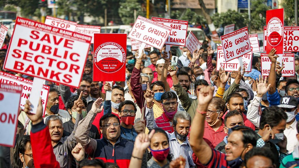 Bank employees shout slogans during the nationwide strike called by the United Forum of Bank Unions in Ahmedabad on 16 December 2021 | PTI Photo