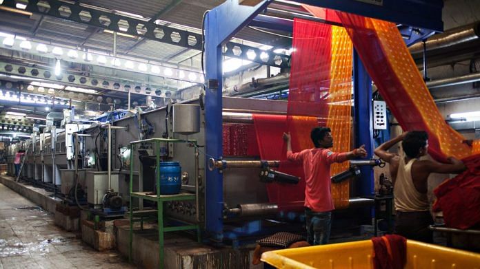Pieces of fabric are dyed at the Siddhi Vinayak Knots & Prints Ltd. factory in Surat | Representational image | Bloomberg