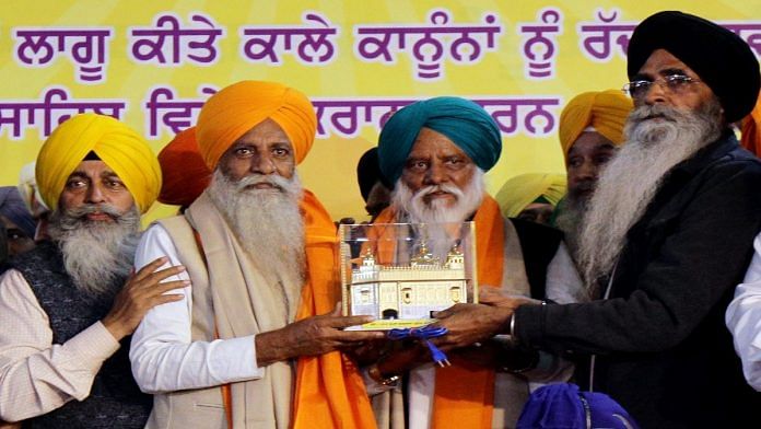 Senior farmer leader Gurnam Singh Chaduni being felicitated with a miniature model of Golden temple at a ceremony held by the Shiromani Gurdwara Parbandhak Committee (SGPC) for the farmer leaders who returned from Delhi borders, in Amritsar on Monday. | ANI
