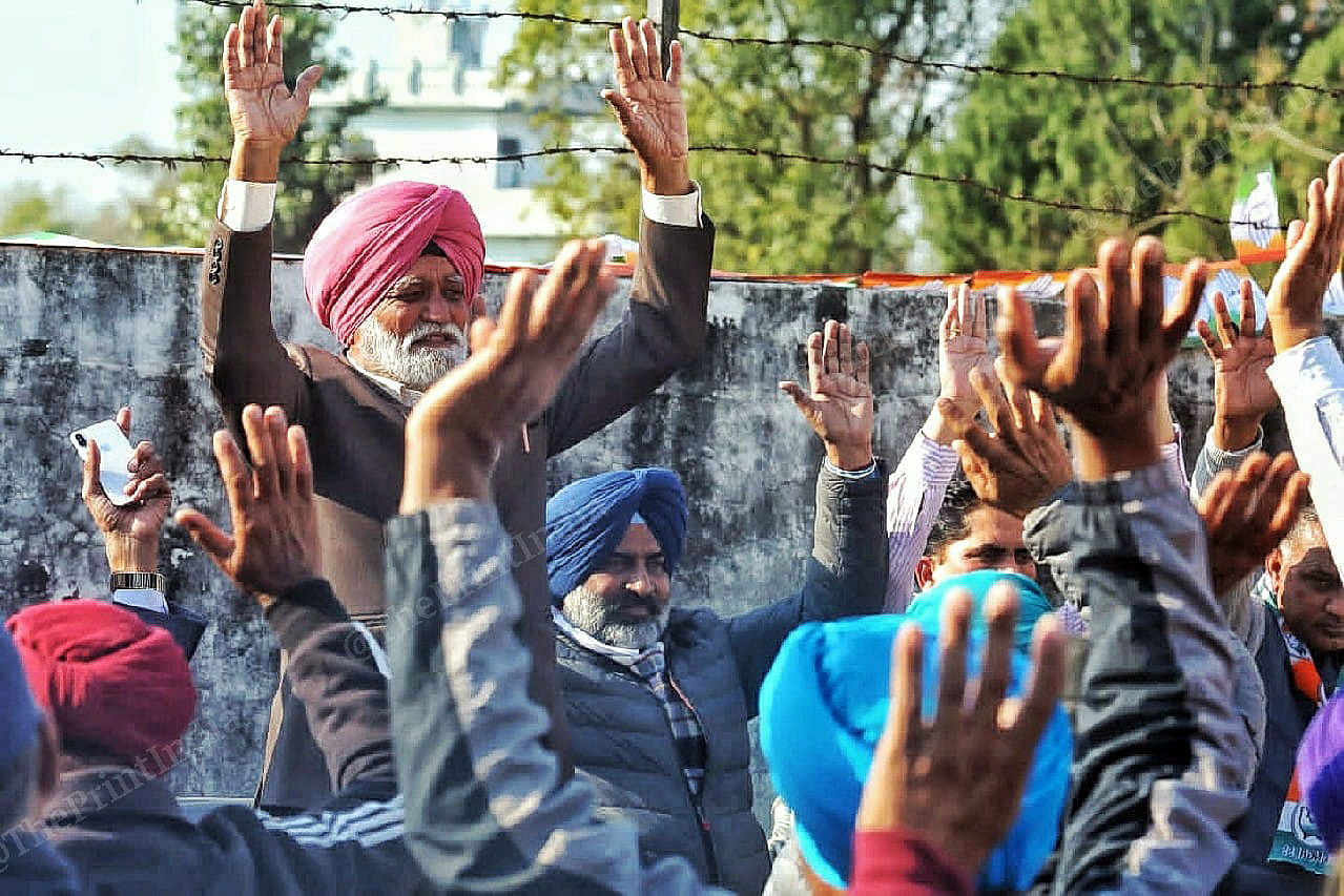 Local villagers rasing hands for Congress cabinet minister in Punjab and hockey player pragat Singh campaigning in his constituency Jandiala Village in Dhani pind Jalandhar cantt | Praveen Jain | ThePrint