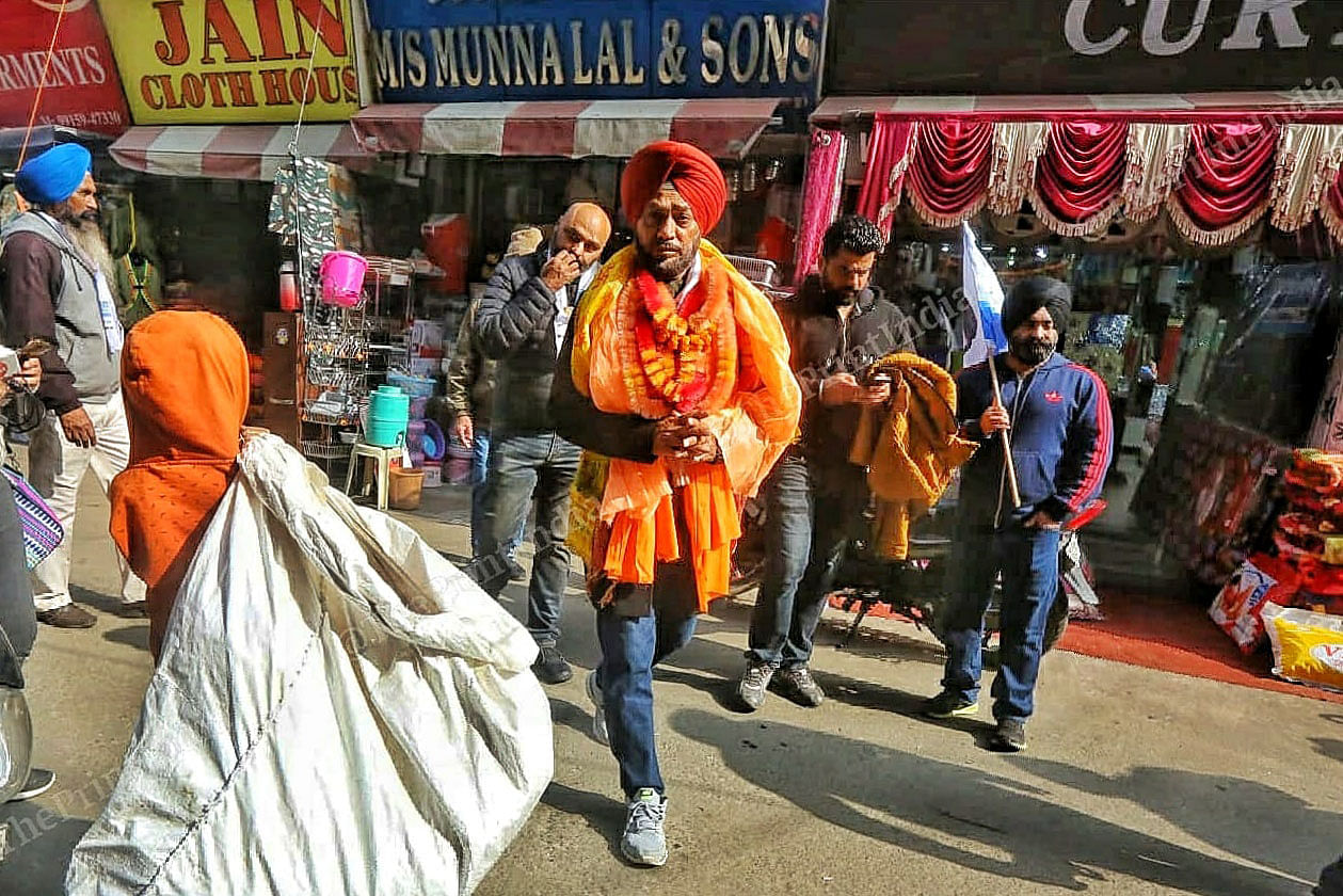 Child Ragpiker looks on the Surinder Sodhi Olympian AAM Party candidate campaigning at jalandhar market cantt area | Praveen Jain | ThePrint