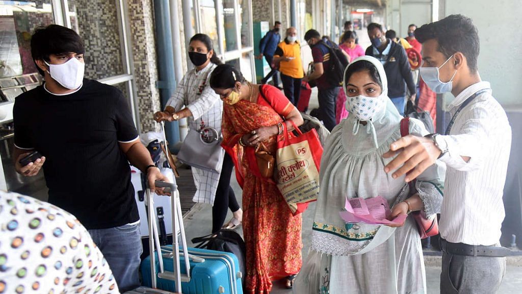 A staff member checking the vaccination certificates of passengers in view of rising number of Covid in Mumbai | Representational photo: ANI