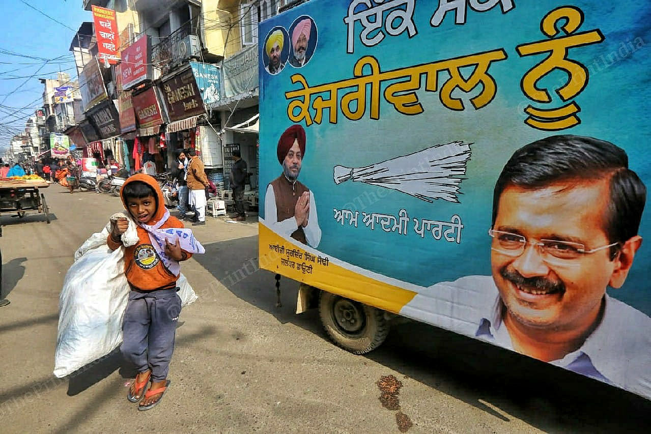 Child Ragpiker passing through the Election van of the Aam Adami party at Jalandhar cantt Bazzar | Praveen Jain | ThePrint