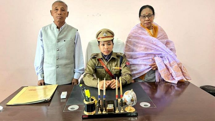 Olympic silver medallist Mirabai Chanu with her parents as she takes charge as additional superintendent of police (sports) with Manipur Police | Twitter | @mirabai_chanu