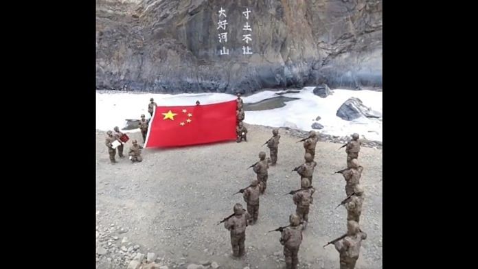 A screengrab of a video showing Chinese flag being waved at Galwan Valley. | Photo Credit: Twitter/@shen_shiwei