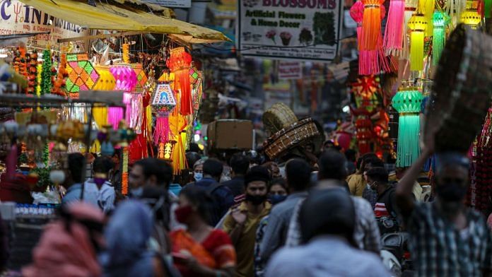 Shoppers and pedestrians pass festive lantern stalls at Crawford Market during the festival of Dhanteras in Mumbai | Representational image | Bloomberg
