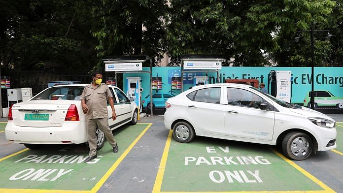 An electric vehicle is parked in a bay at a charging station in New Delhi | Photo: T. Narayan | Bloomberg