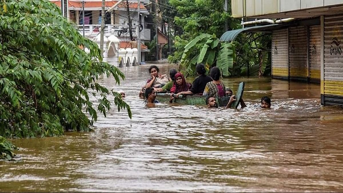 A file photo of people being rescued from a flood-affected region in Kerala's Kochi in 2018 | PTI