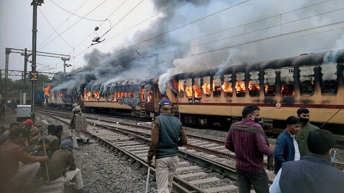 2 boogies of an empty parked train were set on fire by the students at Gaya Junction to protest against the alleged erroneous results of the RRB NTPC exam 2021 on Wednesday | ANI photo