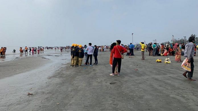 Pilgrims on the beach at the Ganga Sagar mela | Photo: Sreyashi Dey | ThePrint