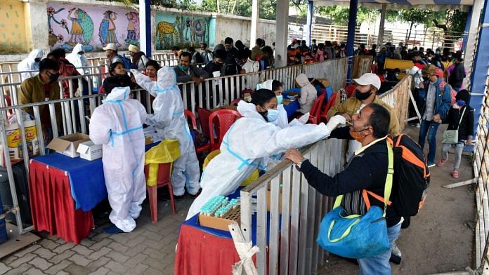 Healthcare workers collect swab samples of the passengers for Covid testing at Hatia railway station in Ranchi | Representational image | ANI photo