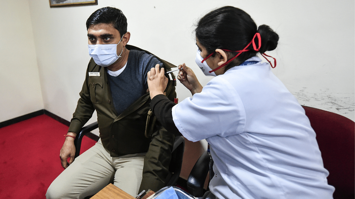 A health worker administers a booster dose of Covid-19 vaccine to a beneficiary in New Delhi | Representational Image | ANI