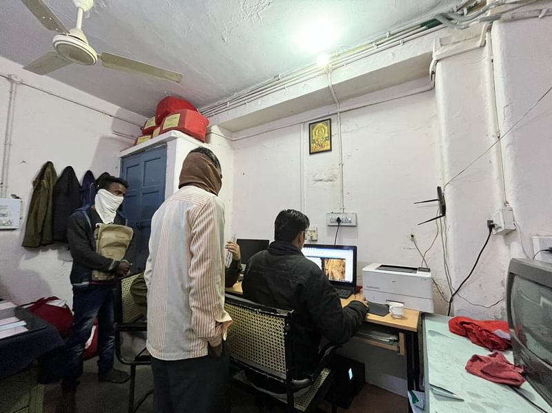 Two policemen play a video for identification in a case, Pali police station | Jyoti Yadav/ThePrint