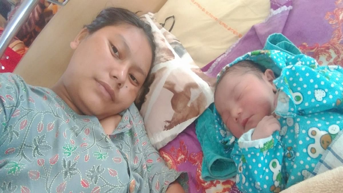 22-year-old villager Pasalam Dupka, who was taken to the 'zero point' by palki while she was in labour Sunday, with her baby  | By special arrangement