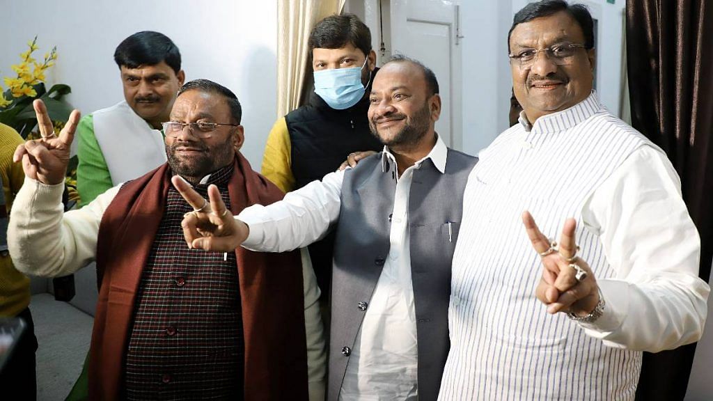 Former Uttar Pradesh ministers Dharam Singh Saini (R) and Swami Prasad Maurya (L) show victory signs after resigning from the BJP, in Lucknow on 13 January. | ANI