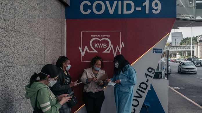 A healthcare worker speaks to travelers at a Covid testing site at Benito Juarez International Airport in Mexico City | Representational image | Bloomberg