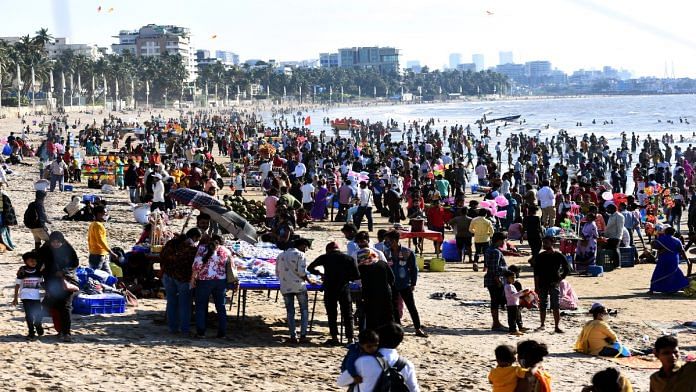 People seen flouting social distancing norms at Juhu Beach amid restrictions imposed due to rising Covid-19 cases in Mumbai | File photo: ANI