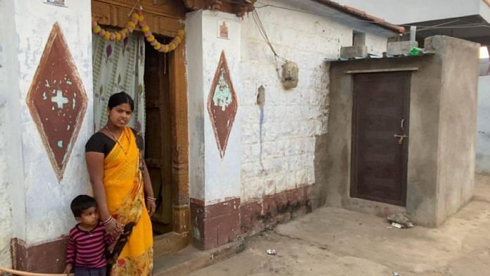 Mogalamma, 24, outside the first toilet ever built in her house, in Telangana’s Mekavanampalle village | Rishika Sadam | ThePrint