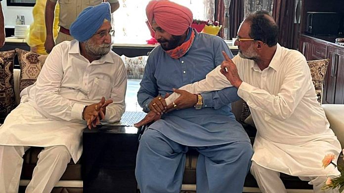File photo of Punjab Deputy Chief Minister Sukhjinder Singh Randhawa (left) with Punjab Congress chief Navjot Singh Sidhu (centre) and Patiala MLA Madan Lal Jalalpur. | ANI