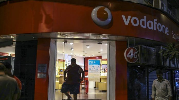 A customer exits a Vodafone Idea store in Mumbai | Representational image | Bloomberg