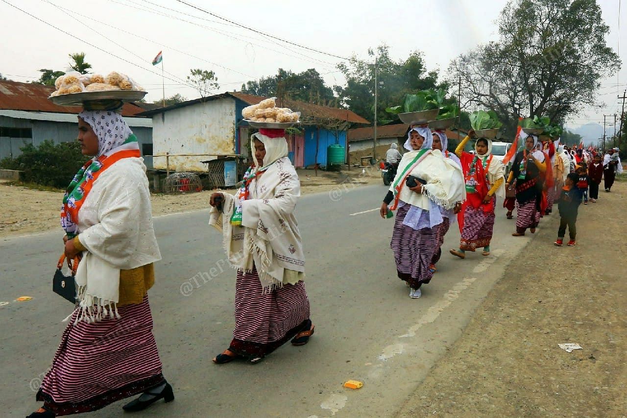 Congress supporters in Wangkhem constituency carry food from their homes for the local candidate as a mark of support | Photo: Praveen Jain | ThePrint