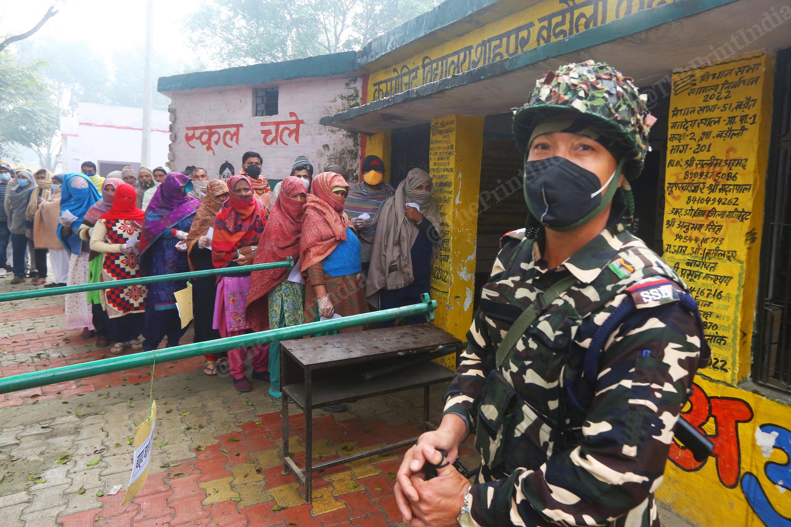 A Sashastra Seema Bal officer on guard outside a polling booth in UP's Shahpur Baroli village | Praveen Jain | ThePrint